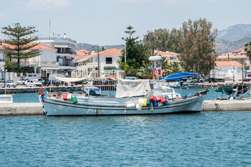 Fishing boats in small Mediterranean bay in sunny summer day