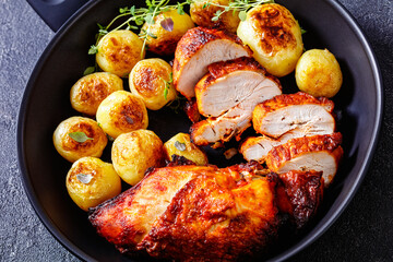 grilled chicken breasts with browned new potatoes