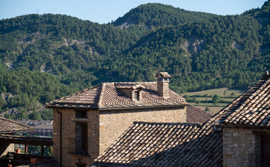 medieval styled stone built property, summer day