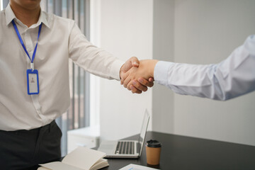Business concept, Business colleagues shake hands together after success company strategy planning