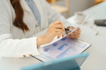 Successful business concept, Businesswoman holds and point financial document to analyzing data