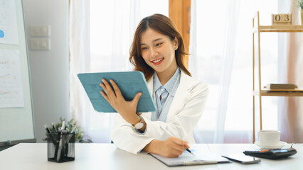 Successful business concept, Businesswoman read financial report on tablet to checking on document