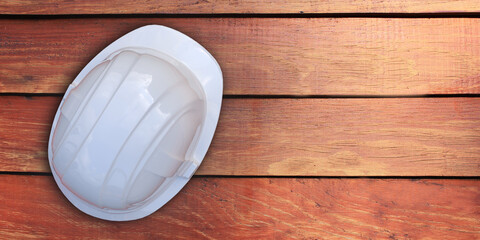Happy Labor day concept: Protective white worker helmet. Construction tool on wood background, with copy space for text. Design template. Vector illustration banner. 3D rendered greeting card poster.