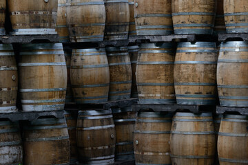 Wooden barrels stacked on pallets, Spanish wine barrel, oak