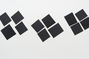 black paper squares
