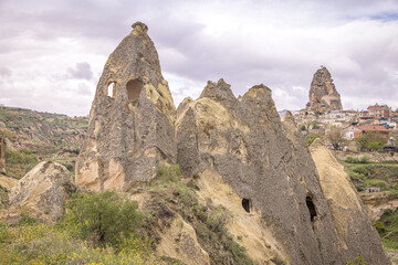 Fototapeta na wymiar Fairy Chimneys by Ishak Castle, Uçhisar, Nevşehir, Cappadocia, Turkey