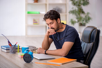Young male designer working in the office