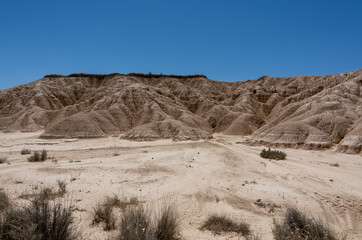 a semi-desert natural region or badlands composing clay, chalk and sandstone