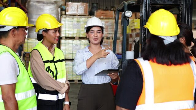 Engineer new staff employee and team worker meeting on morning talk befor work. Indian female manager team leader talking and training at  industrial warehouse factory. Fat women worker