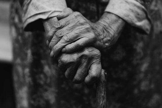 Close-up hands of an old person, black and white photo
