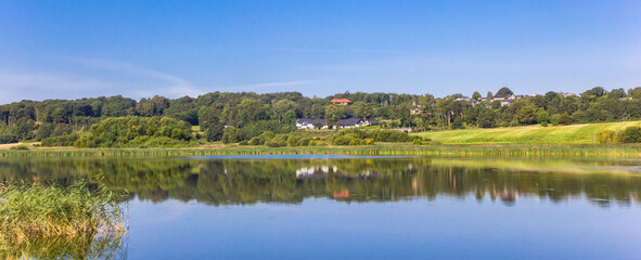 Panorama of the tranquil water of the blue lake near Hobro