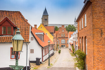 Street with old houses leading to the Domkirke church in Viborg