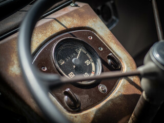 Dashboard and steering wheel of old-timer car