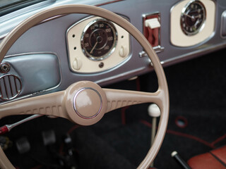 Dashboard and steering wheel of old-timer car