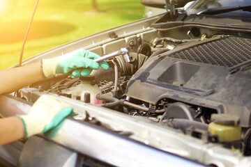 Mechanic open the car hood to check the engine. Repair service.