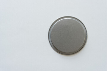 metallic lid on blank paper