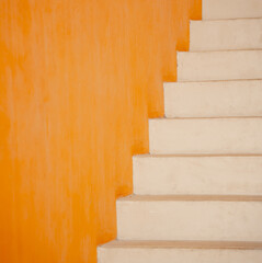 Metal stairs on the big orange wall