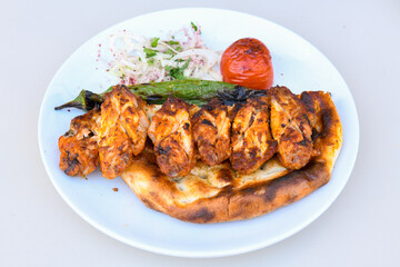Chicken wings barbeque in a dish with BBQ grill sauce . Izgara tavuk kelebek sis kanat. Tavuk sis, gogus.