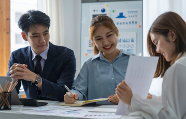 Asia business group meeting and discuss new startup concept projects Business team planning, strategic analysis and brainstorming with office paper reports.