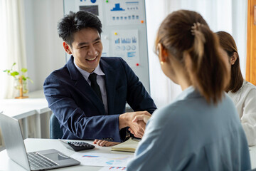 Asia business group meeting and discuss new startup concept projects Business team planning, strategic analysis and brainstorming with office paper reports.