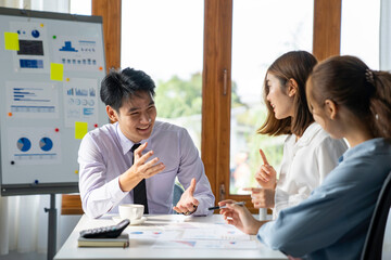 Asia business group meeting and discuss new startup concept projects Business team planning, strategic analysis and brainstorming with office paper reports.