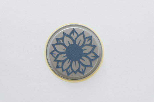 Sunflower Cutout On A Metal Lid With Blank Space