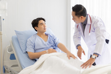 Fototapeta premium Professional orthopaedist male doctor and nurse visiting checking examine knee condition male patient at hospital