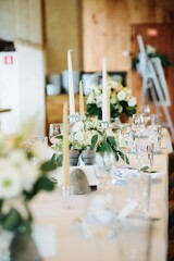 Table with wedding decor and white flowers