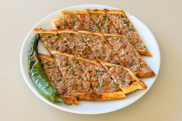 Kiymali pide. Turkish pide with minced meat. Turkish pizza mince pita Pide on white background. Etli ekmek. Kusbasi kasarli pide.