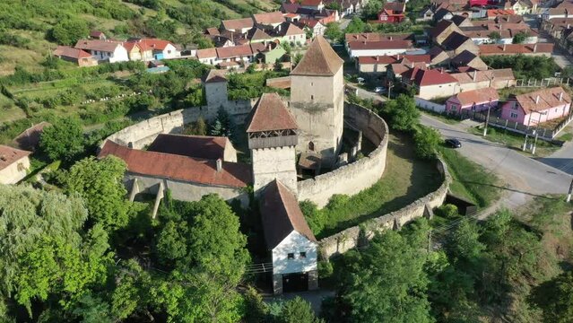 Calnic - medieval fortress on the hills over Calnic village. Old defensive bastion, with stone walls surrounding the church, is located in a rural area of Transylvania, Romania, UNESCO World Heritage