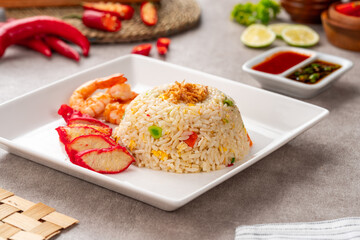Yangzhou fried rice is a popular Chinese-style wok fried rice dish. Asia Chinese China food cuisine. Authentic Yangzhou fried rice with egg, fresh prawn and Red Roast Pork.