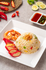 Yangzhou fried rice is a popular Chinese-style wok fried rice dish. Asia Chinese China food cuisine. Authentic Yangzhou fried rice with egg, fresh prawn and Red Roast Pork.
