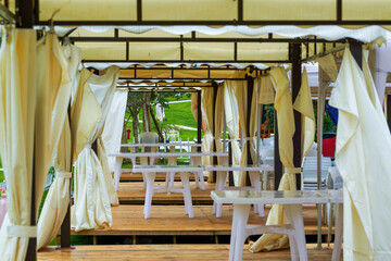 White table and chair arrangement for outdoor tent party