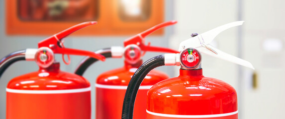 Fire extinguisher, Close-up red fire extinguishers tank in the building for fire equipment for extinguishing or protection and prevent for emergency and safety rescue and alarm system training.