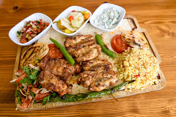 Chicken wings barbeque in a dish with BBQ grill sauce . Izgara tavuk kelebek sis kanat. Tavuk sis, gogus.