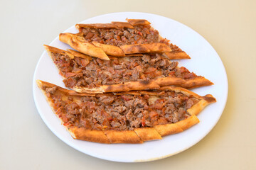 Kiymali pide. Turkish pide with minced meat. Turkish pizza mince pita Pide on white background. Etli ekmek. Kusbasi kasarli pide.