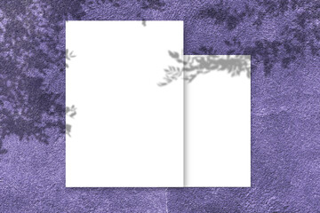 Blank white square poster mockup with light shadow on purple concrete wall background.