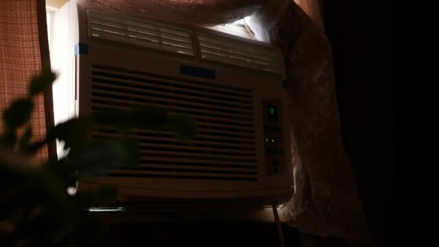 A Window AC Air Conditioning Unit in window - active cooling concept