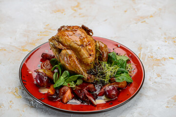 tobacco chicken in a plate with salad
