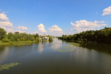 Fototapeta na wymiar View of Southern Bug river and a church of Blessed Xenia of St. Petersburg in Vinnytsia, Ukraine