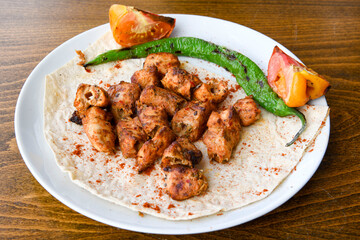 Chicken wings barbeque in a dish with BBQ grill sauce . Izgara tavuk kelebek sis kanat. Tavuk sis, gogus.