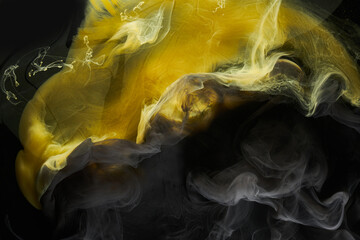Liquid fluid art abstract background. Black, yellow dancing acrylic paints underwater, space smoke ocean © amixstudio
