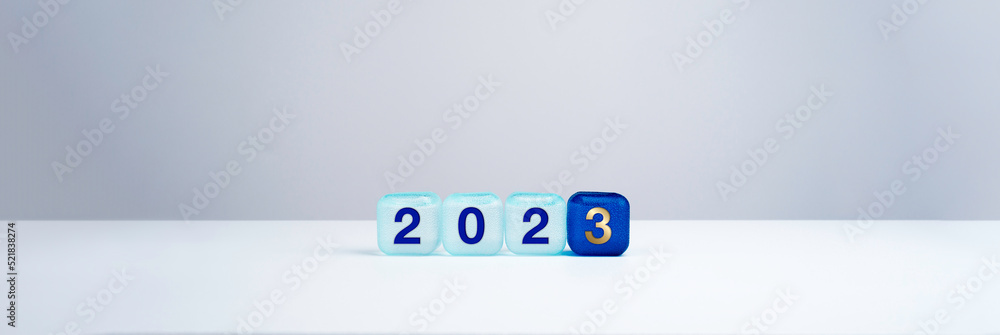 Poster 2023 happy new year background banner. two thousand twenty-three year numbers on blue cube blocks is