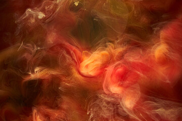 Fototapeta na wymiar Liquid fluid art abstract background. Red, yellow dancing acrylic paints underwater, space smoke ocean, color explosion
