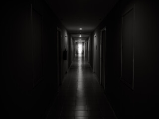 Dark mysterious corridor in building. Door room perspective in lonely quiet building with walkway...