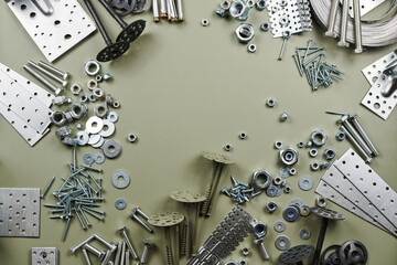 Set of bolts nuts nails metal fasteners. Consumable hardware tools. assortment steel screws collection close up background