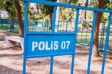 Fototapeta na wymiar Police fence in city park in Turkish town