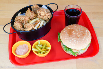 Big tasty burger with beef cutlet on a plate. Crispy chicken burger.