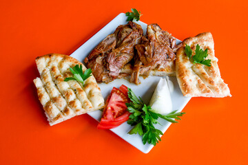 Beef steak grill with rice pilaf, fried potatoes, grilled pepper and tomatoes.Mix Platter with Beef rips, Cutlets, Potatoes and Sauces.