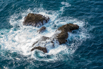 ocean rocks with foam